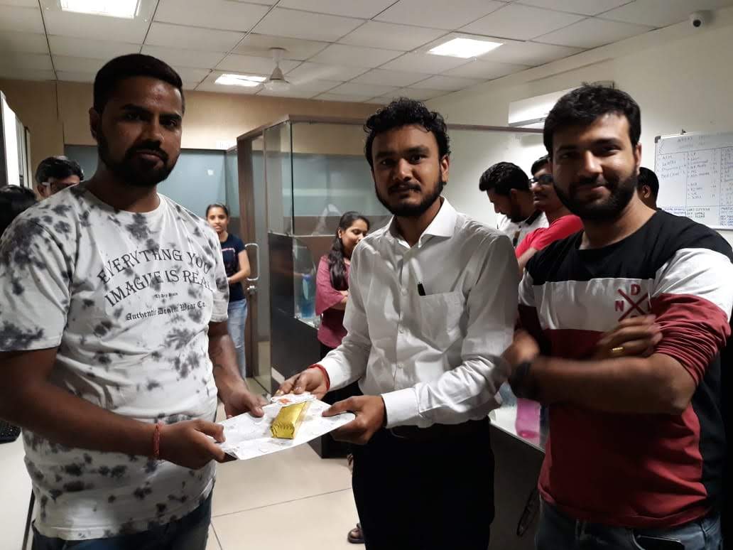 Team member receiving a recognition gift
